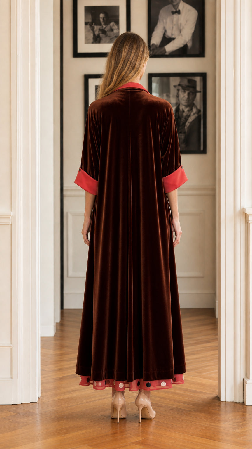Back view of full-length brown velvet coat with contrast fold-back cuffs