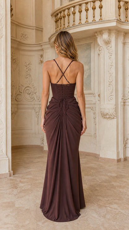 Back view of chocolate brown evening dress featuring crisscross straps and lace-up corset detail