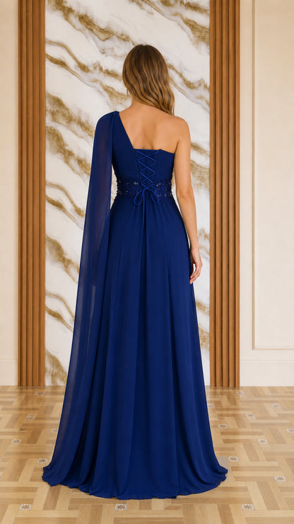 Back view of navy blue evening dress showing lace-up back and cape