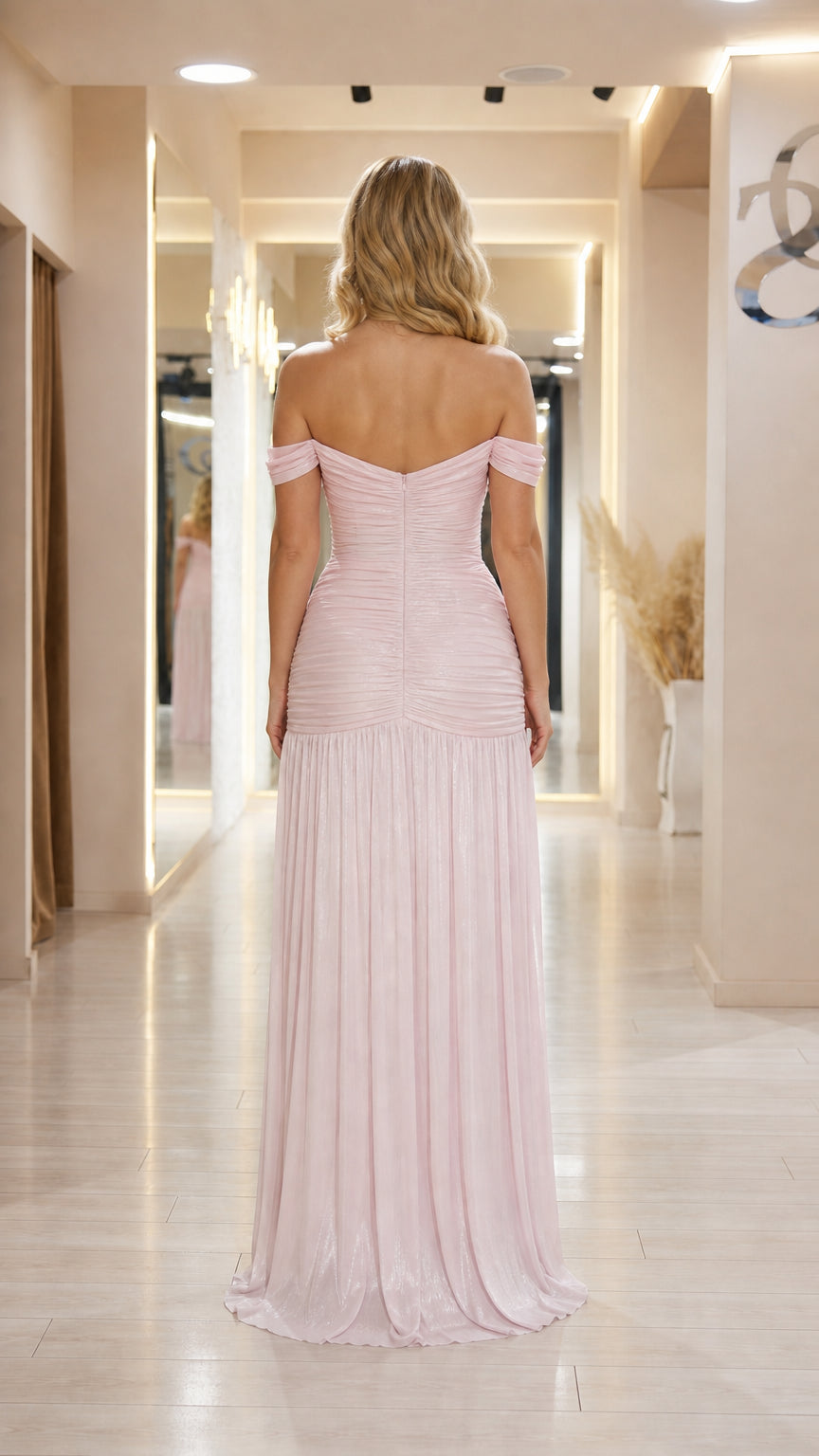 Back view of model wearing pink off-the-shoulder evening gown