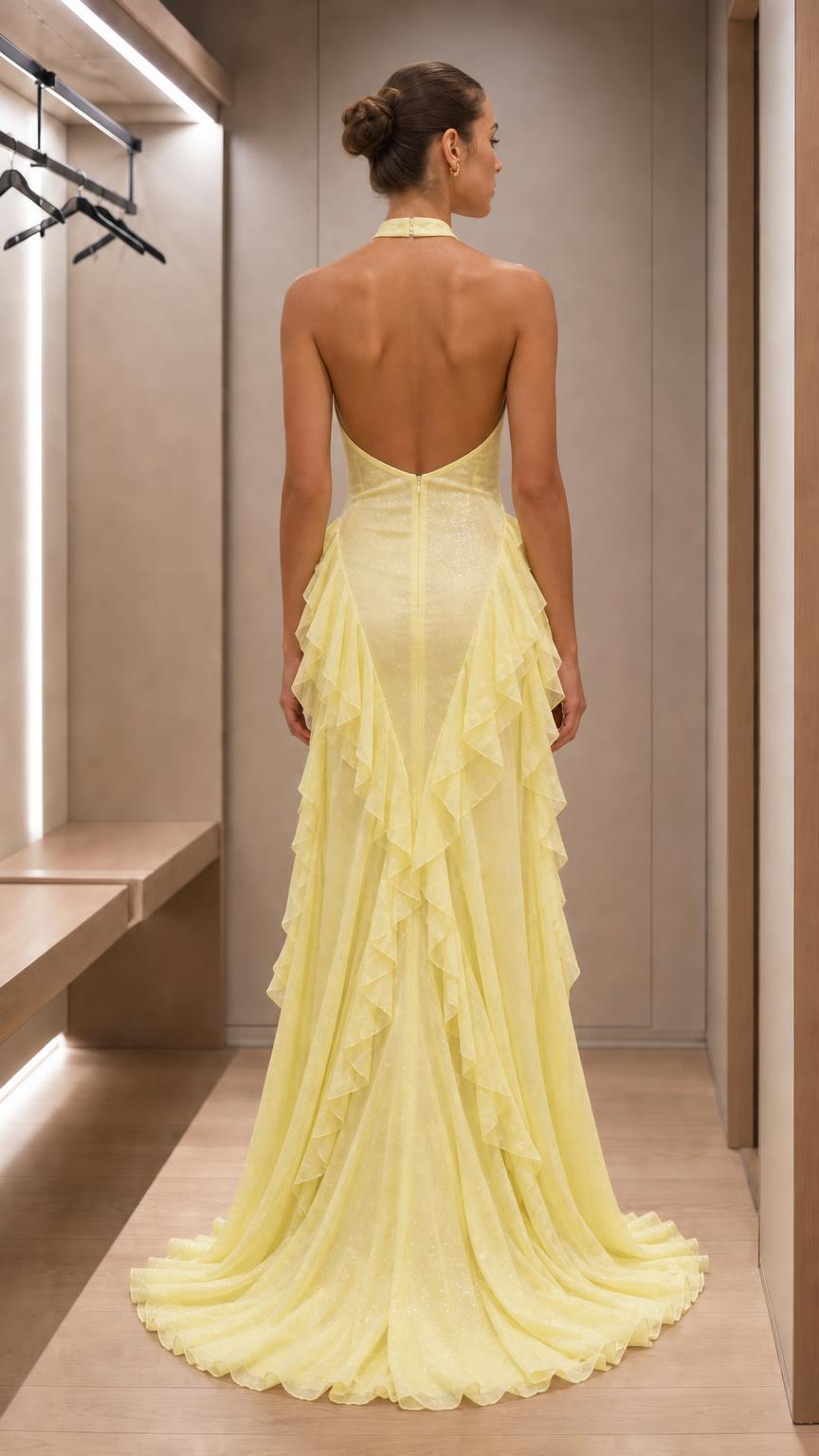 Back view of yellow evening dress showing open back and train