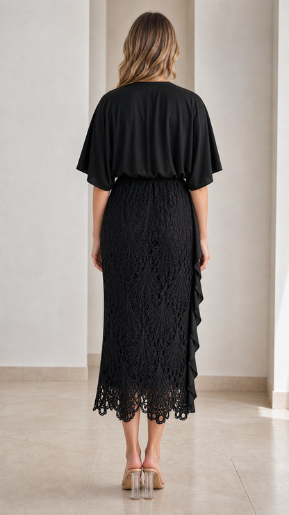 Back full-length view of black capelet sleeve lace midi dress