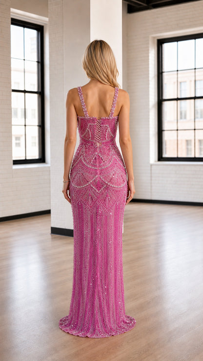Back view of model showcasing detailed straps on pink maxi dress