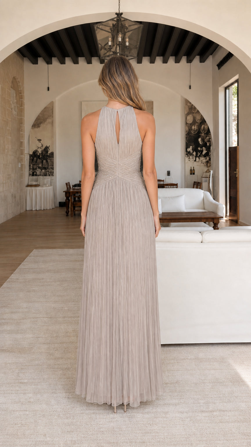 Back view of model showing keyhole detail on taupe dress