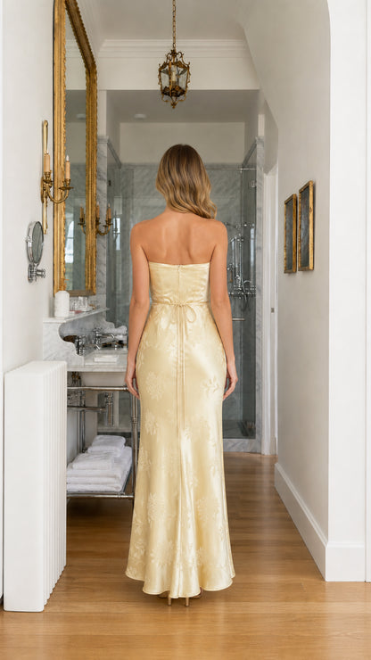 Back view showing tie detail on yellow maxi dress