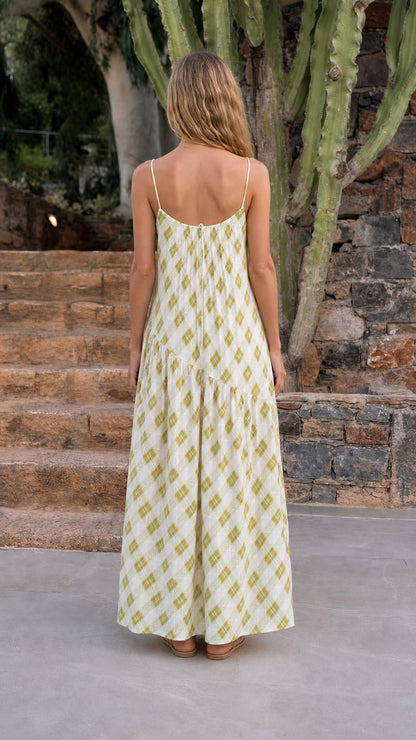 Back view of woman wearing sage green plaid maxi dress