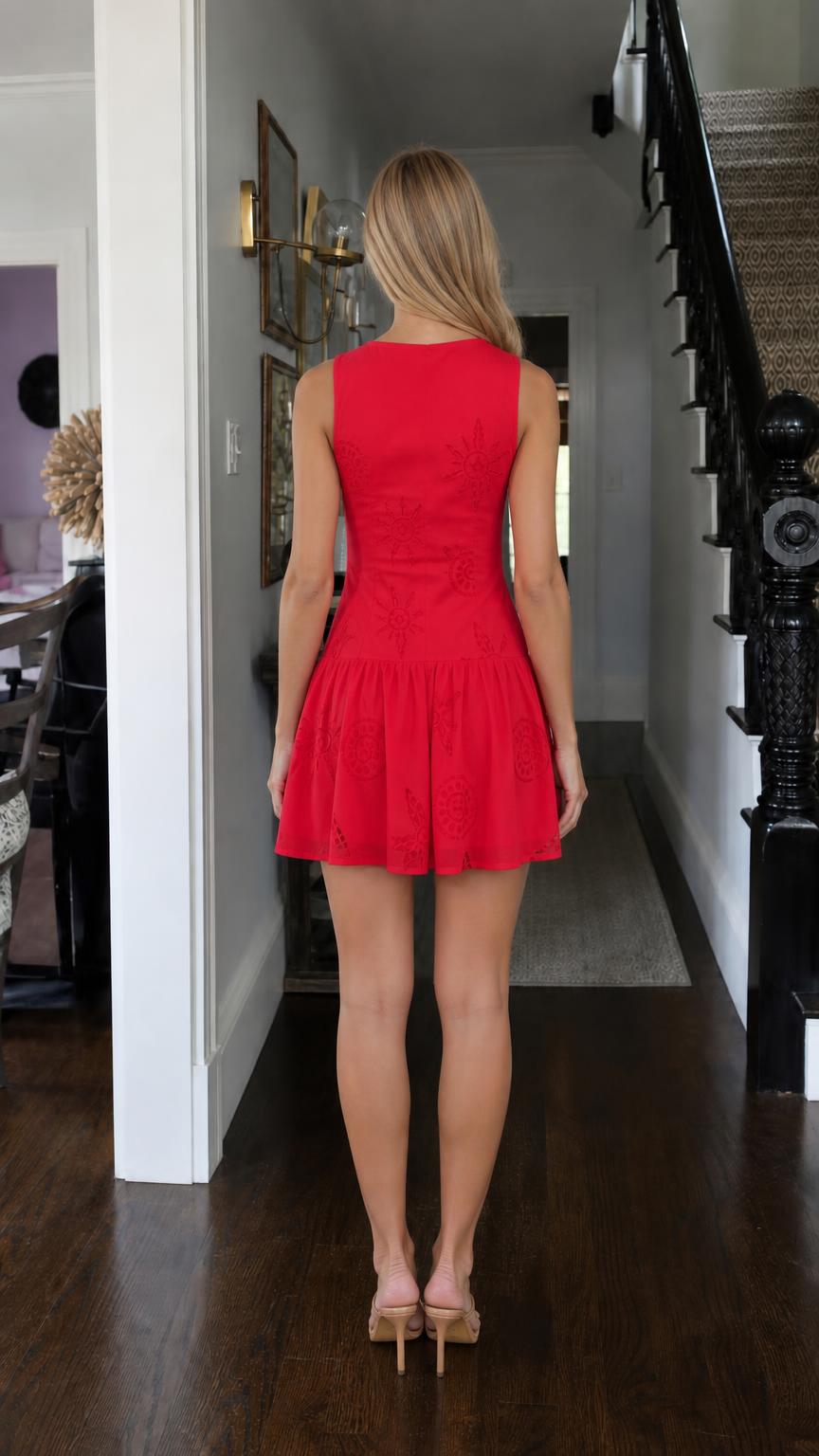 Back view of model wearing red embroidered mini dress