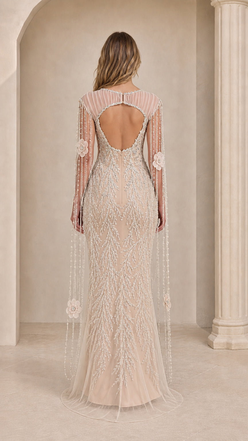 Back view of champagne gown showing open back cutout and long beaded cape