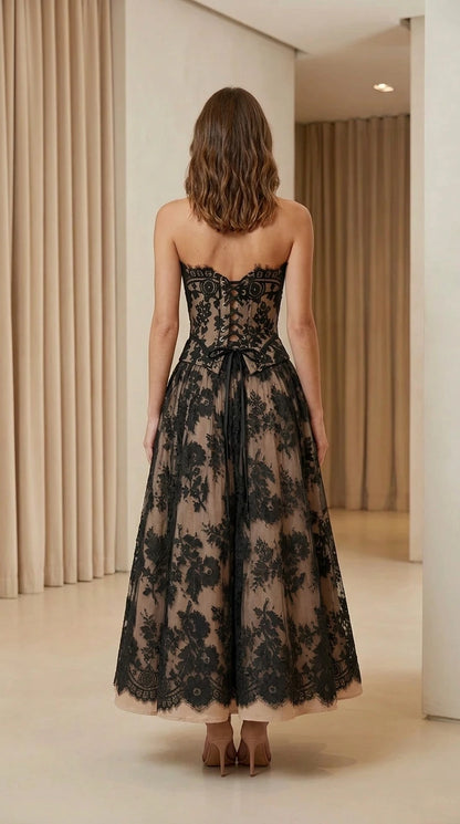 Model wearing strapless lace corset midi dress back view