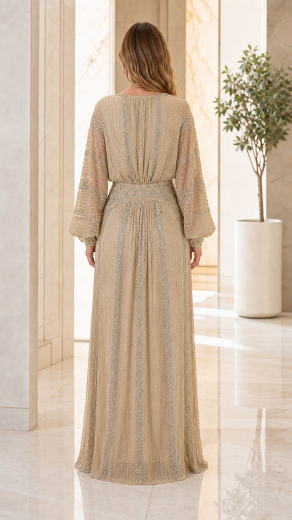 Back view of Champagne Gold embellished long sleeve formal gown