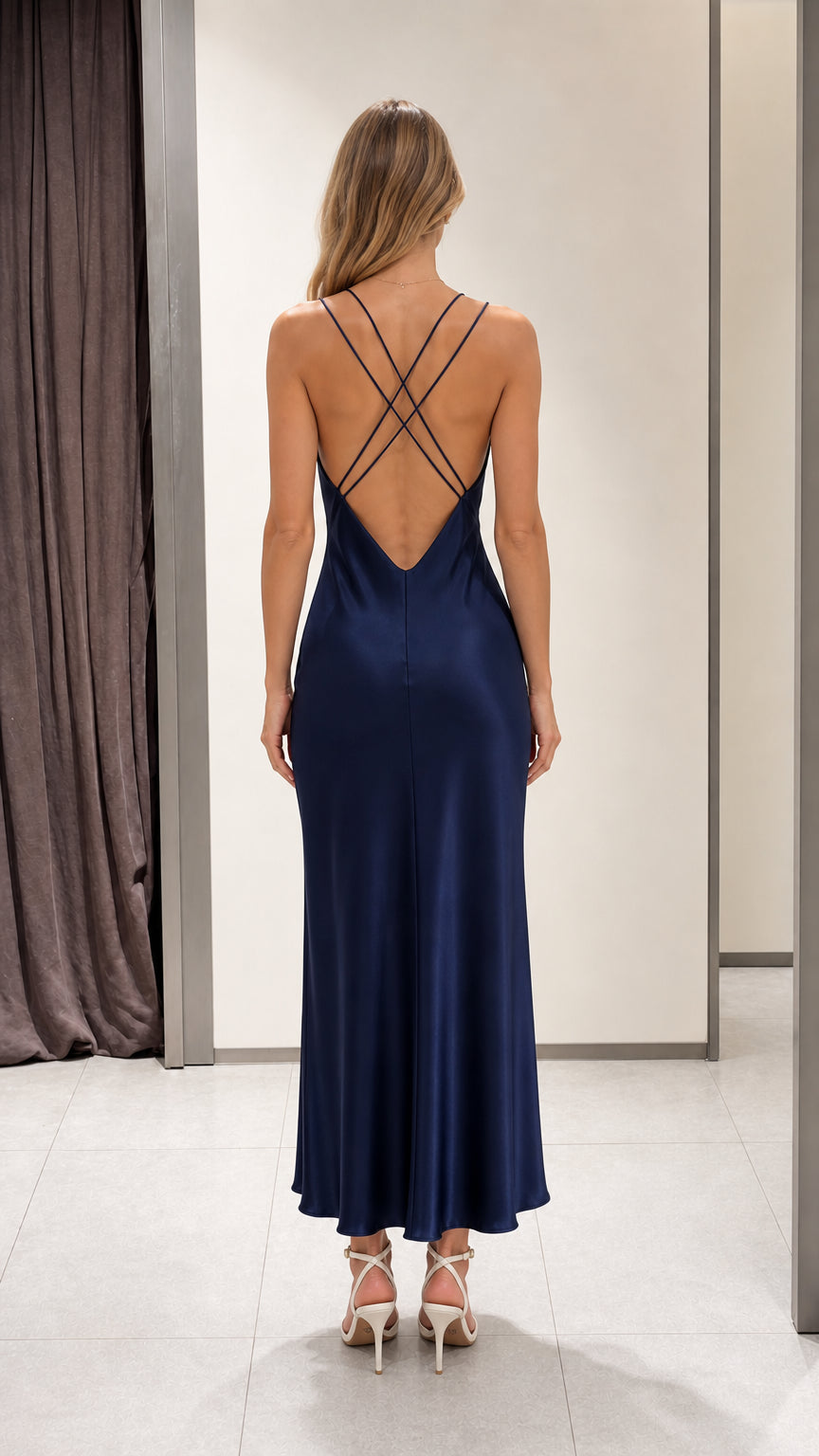 Back view of a navy maxi dress with crossed straps and an open back