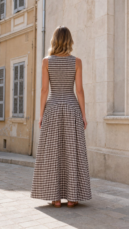 Model in brown gingham maxi dress, back view