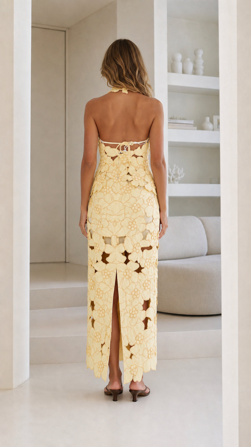 Back view of Yellow floral laser-cut halter dress