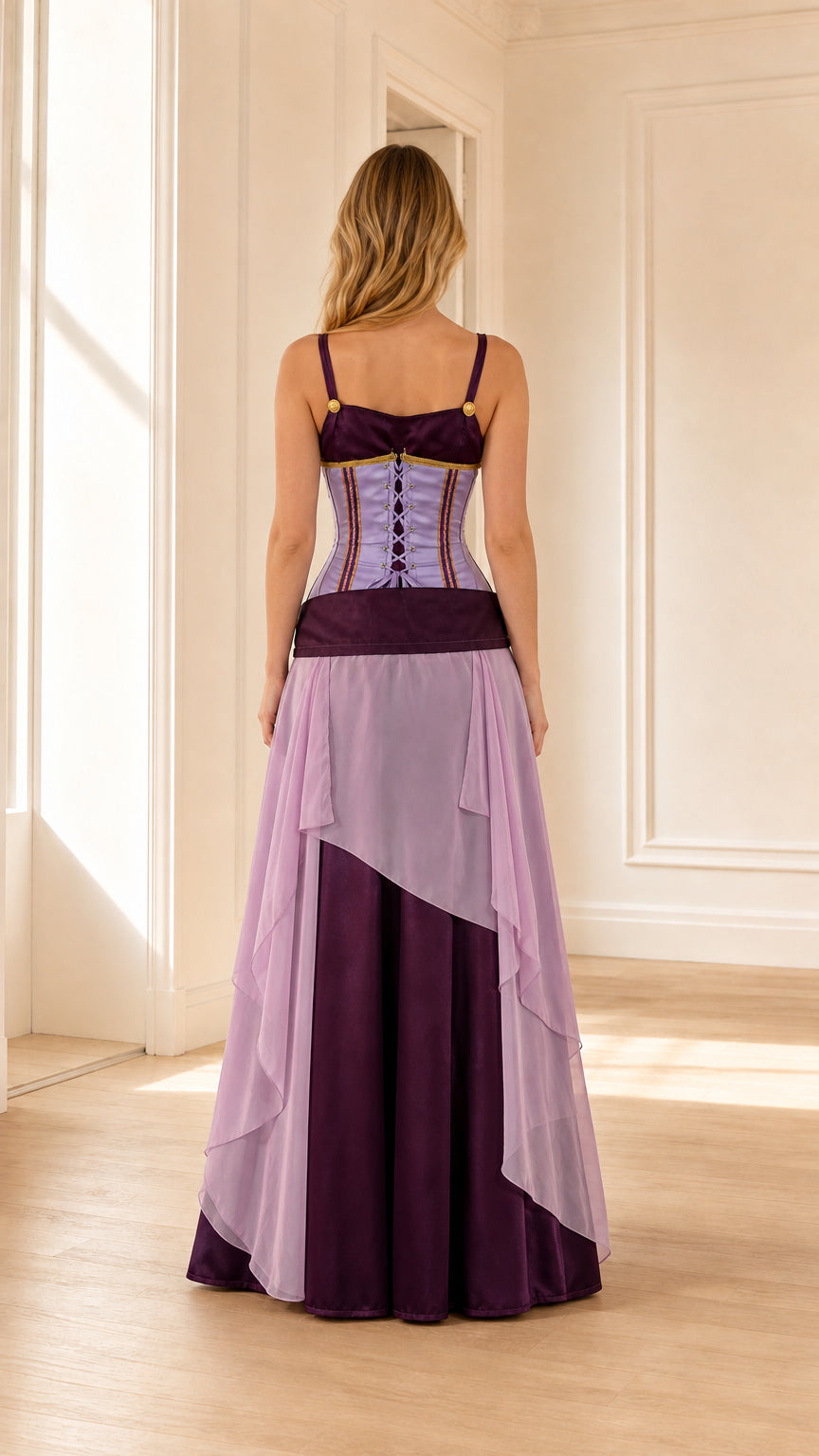Back view of woman wearing purple corset maxi dress showing adjustable lace-up back detail