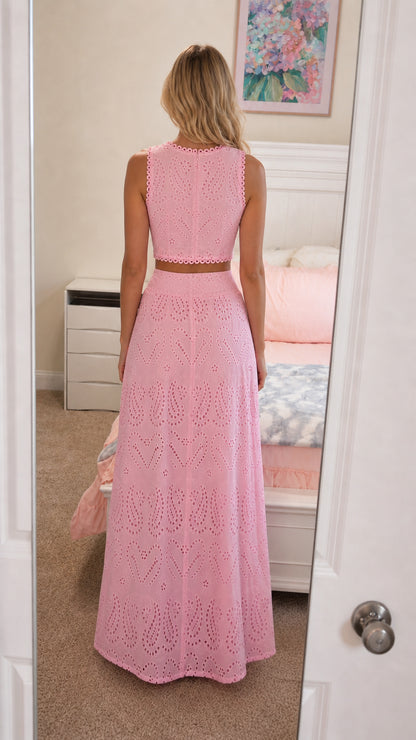 Back view of model in pink two-piece set