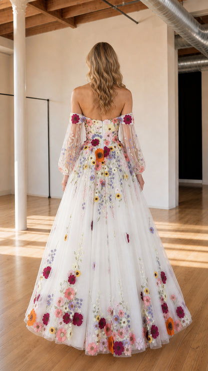 Back view of ivory off-the-shoulder tulle maxi gown with floral detailing