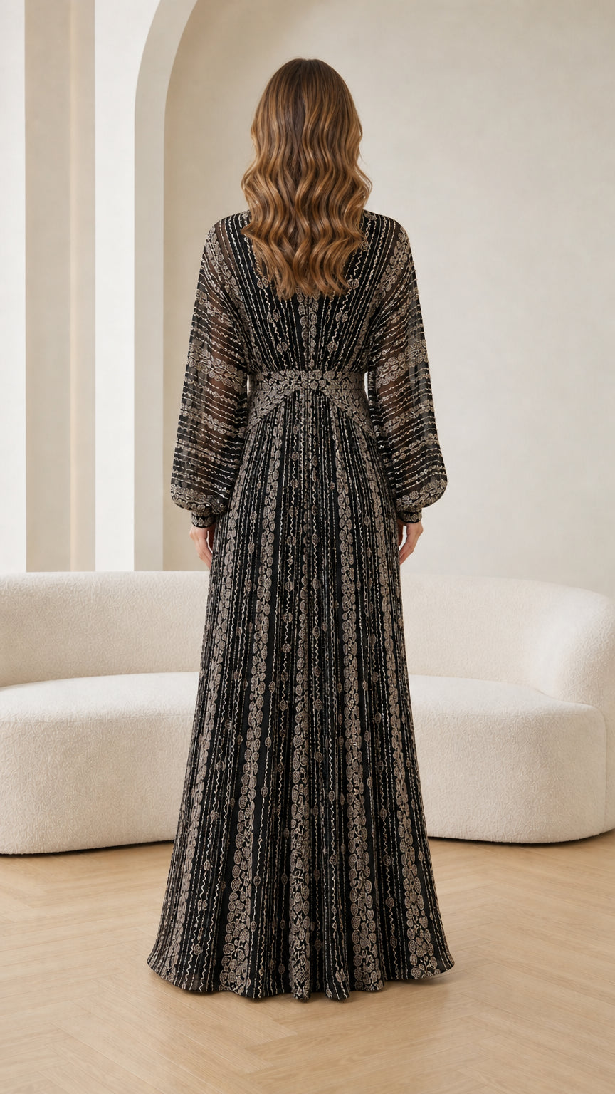 Back view of woman wearing long sleeve black beaded maxi formal dress