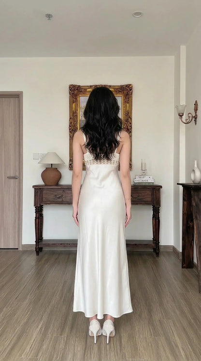 Back view of white satin maxi slip dress