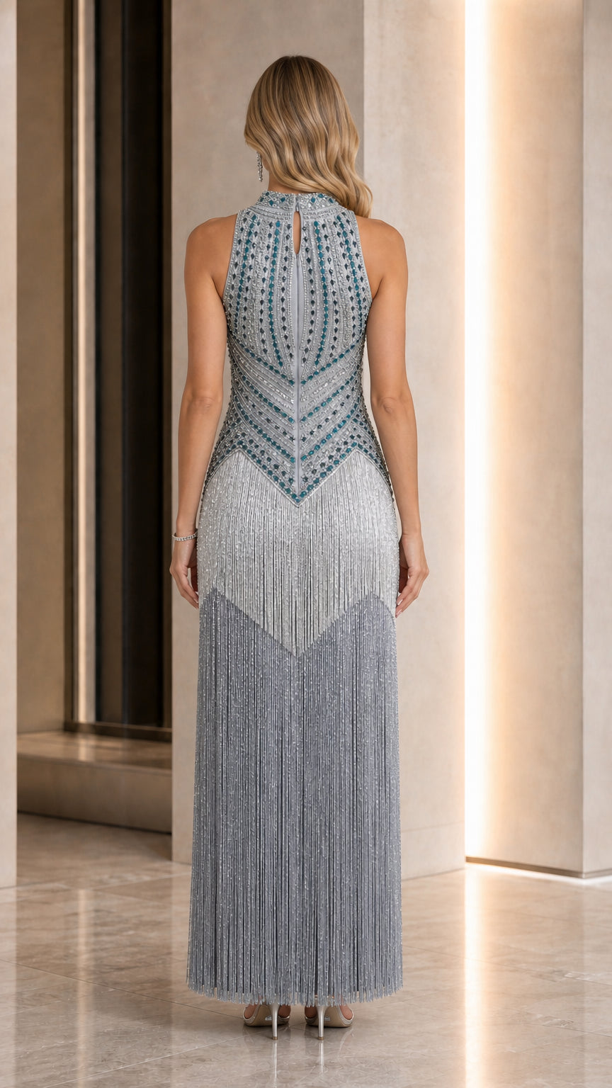 Back view of dusty blue halter beaded formal gown showing zipper closure