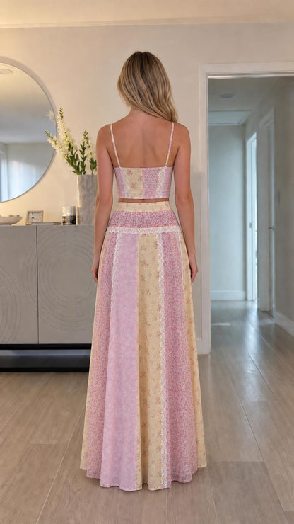 Back view of model showing back straps and maxi skirt flow