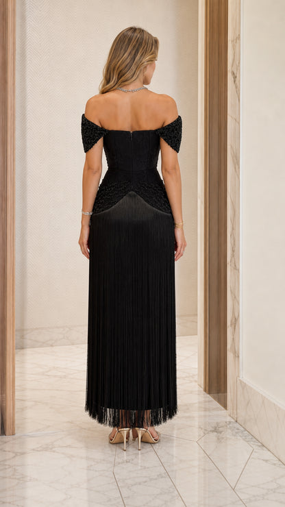 Back view of black off-the-shoulder beaded fringe evening gown
