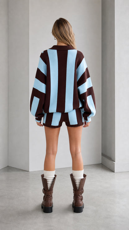 Back full-length view of brown and sky blue striped oversized knit sweater and shorts