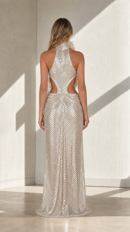 Silver sequin halter maxi dress showing the open back and waist cutouts