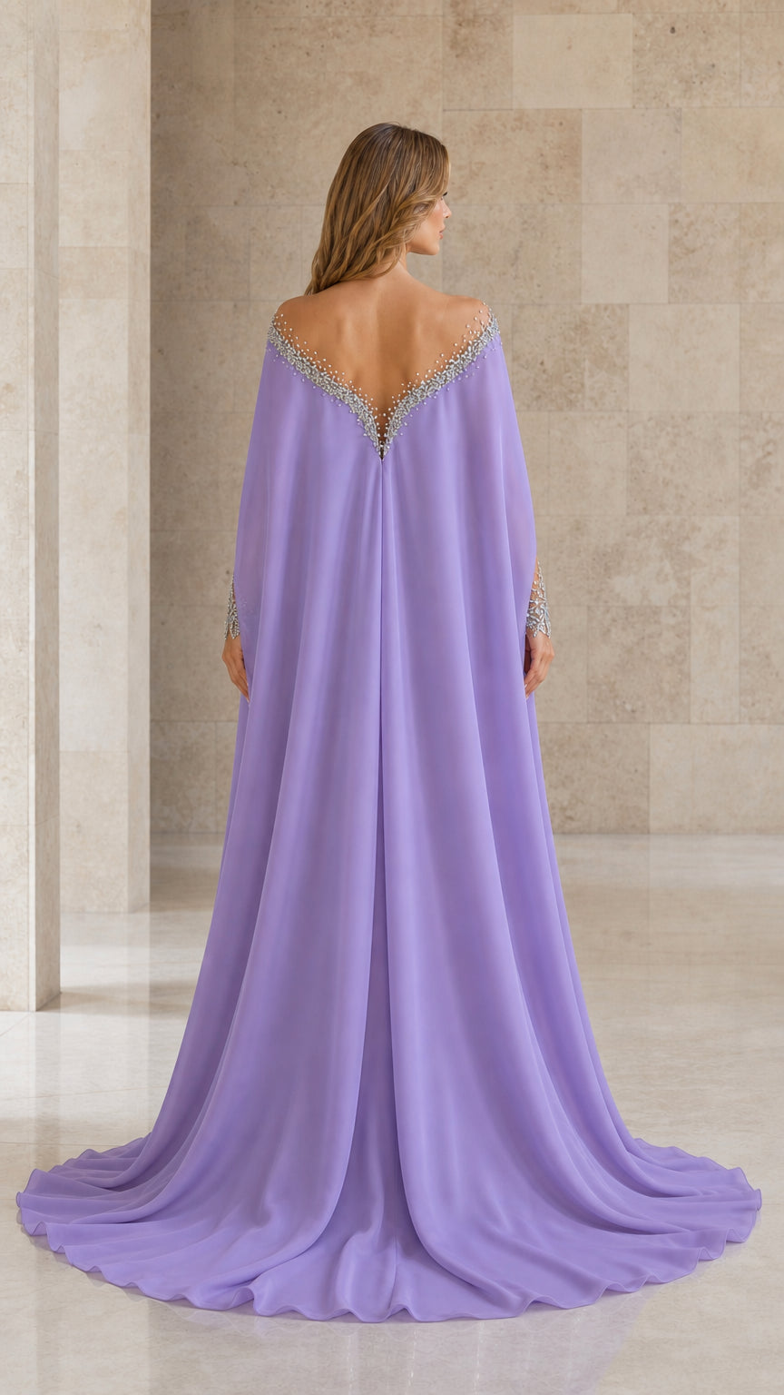 Back view of lavender gown highlighting the sweeping chiffon cape and illusion back