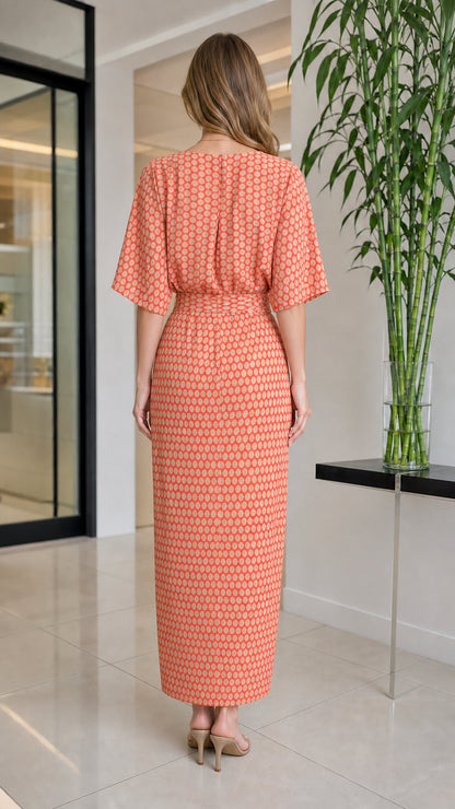 Back view of orange geometric print maxi dress