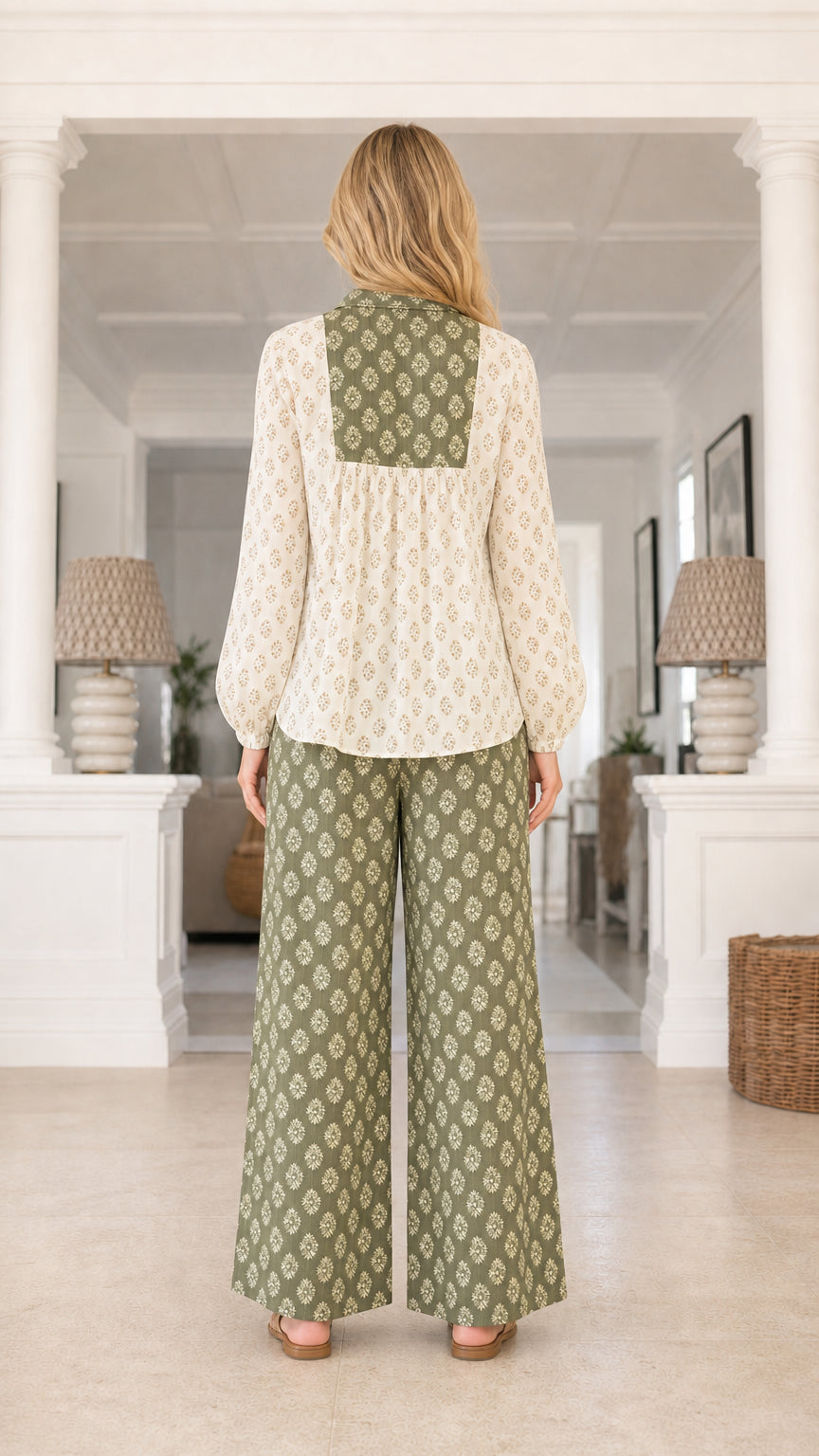 Model wearing sage green printed two piece set back view