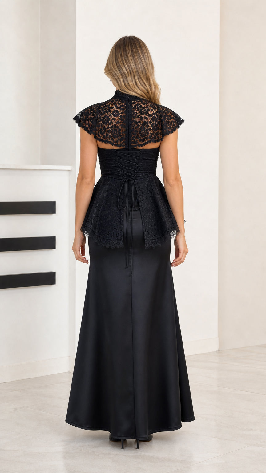 Back view of black lace bodice evening gown showing waist tie detail