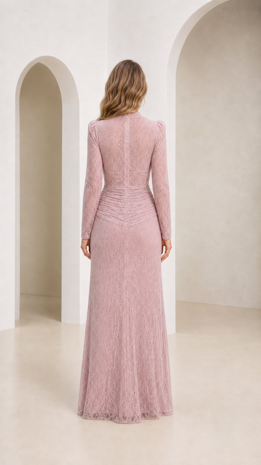 Back view of model wearing dusty rose long sleeve gown