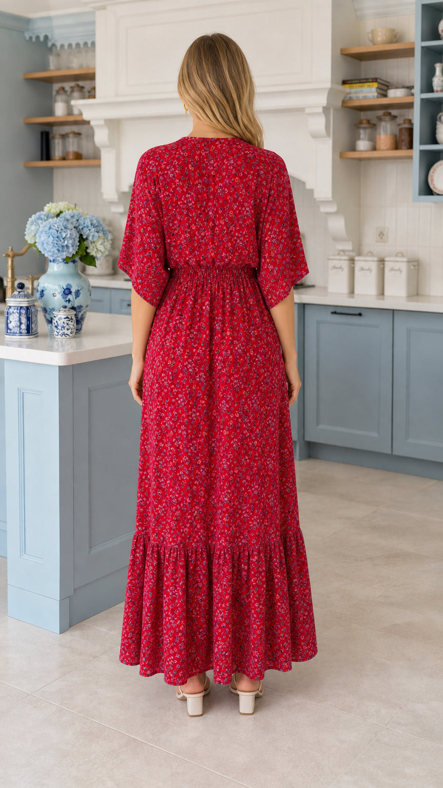 Back view of model showing gathered waistline of red floral tiered maxi dress