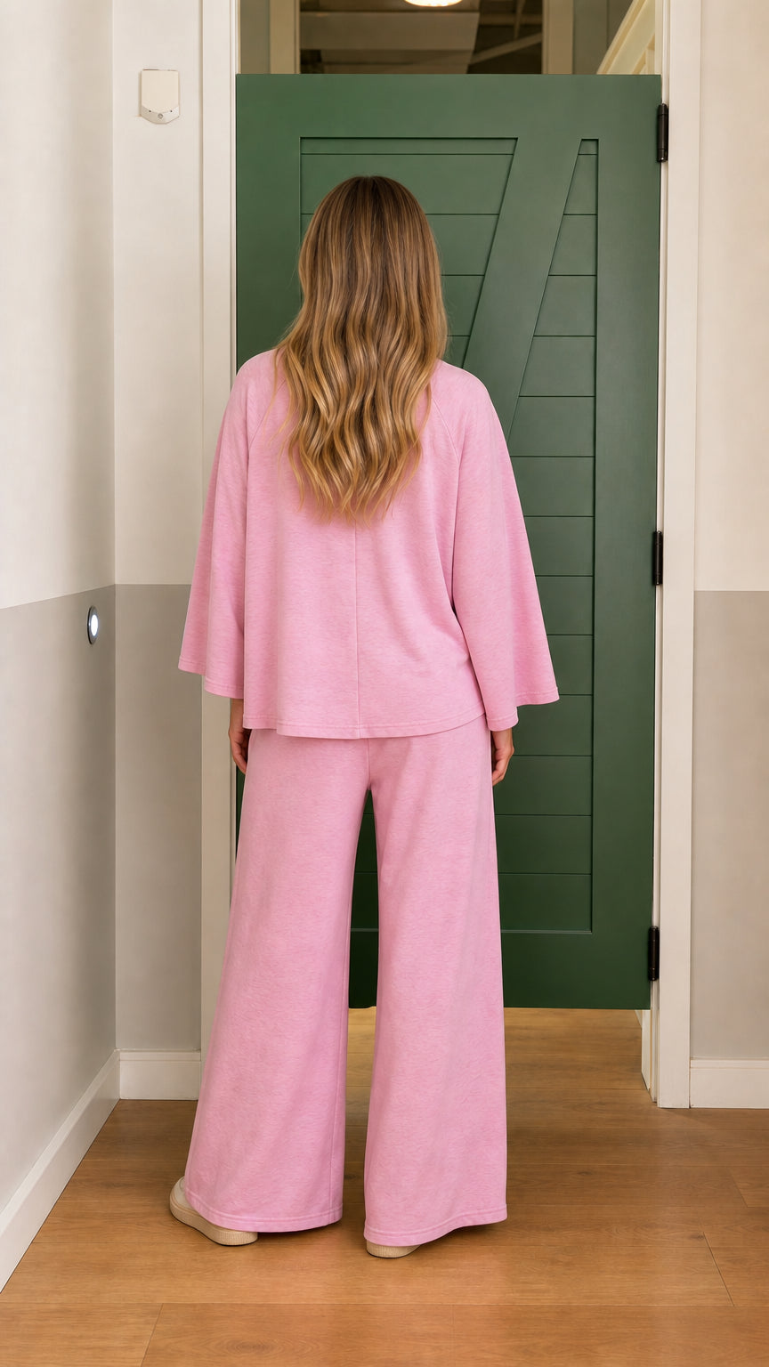 Back view of model wearing pink wide-leg lounge set