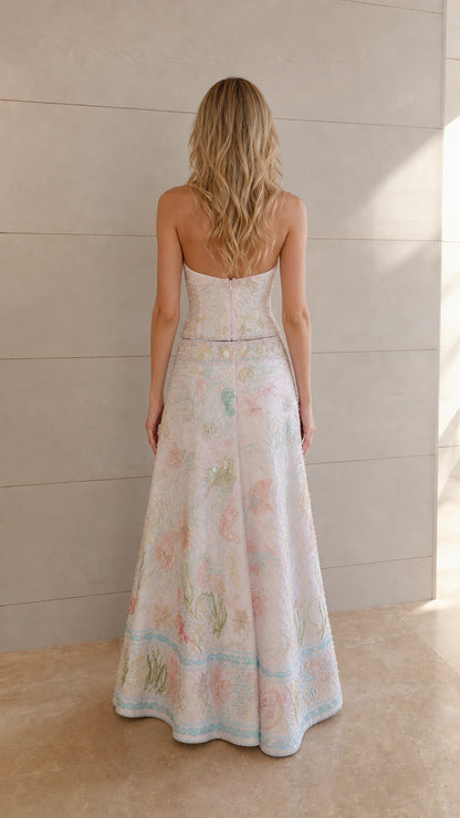 Back view of ivory halter top and embroidered maxi skirt set