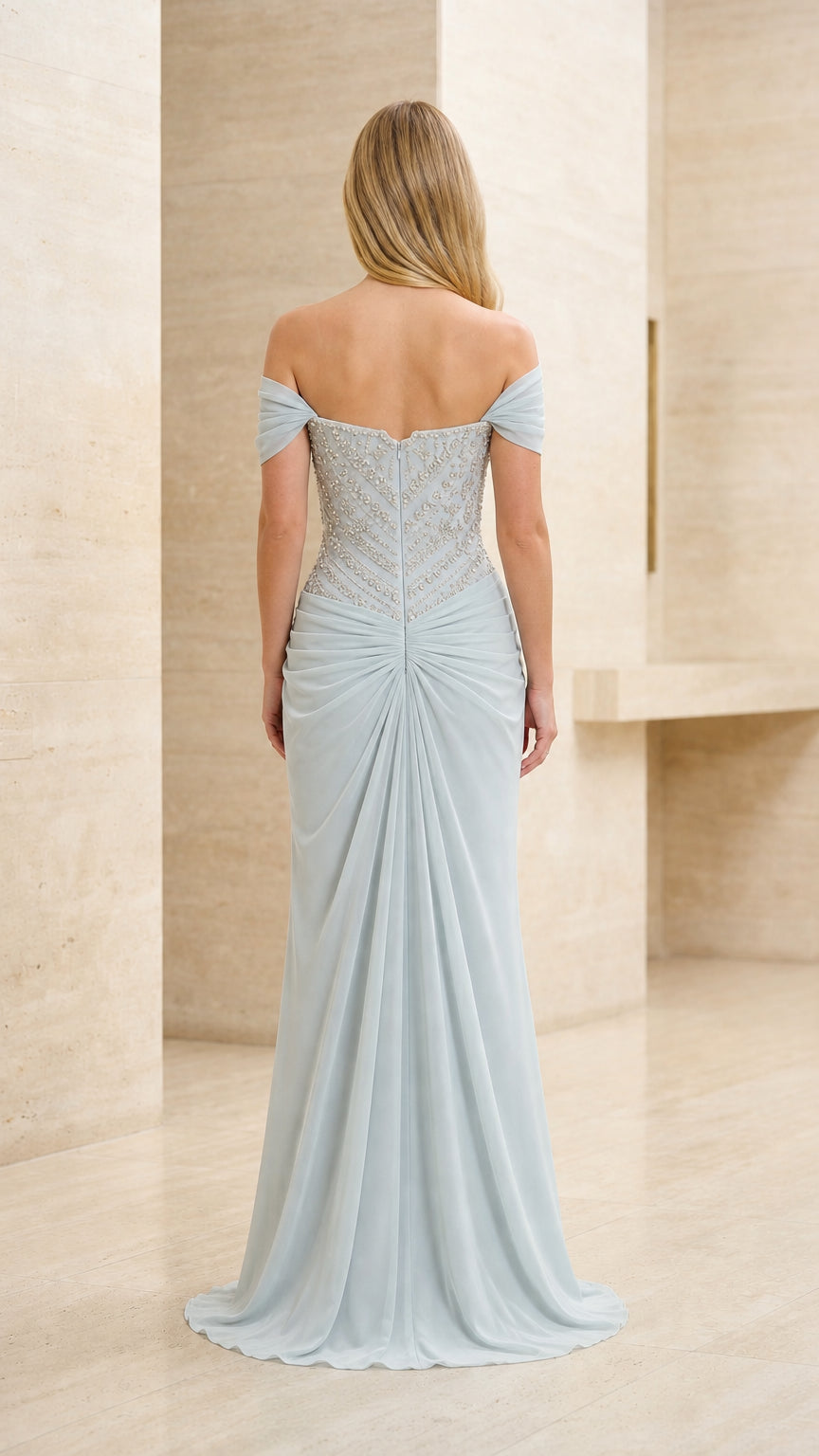 Back view of model in ice blue beaded off-the-shoulder evening gown