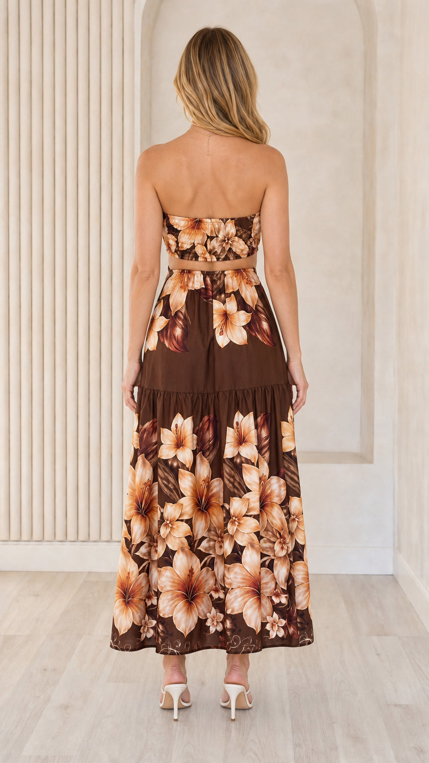 Back view of brown floral strapless maxi dress