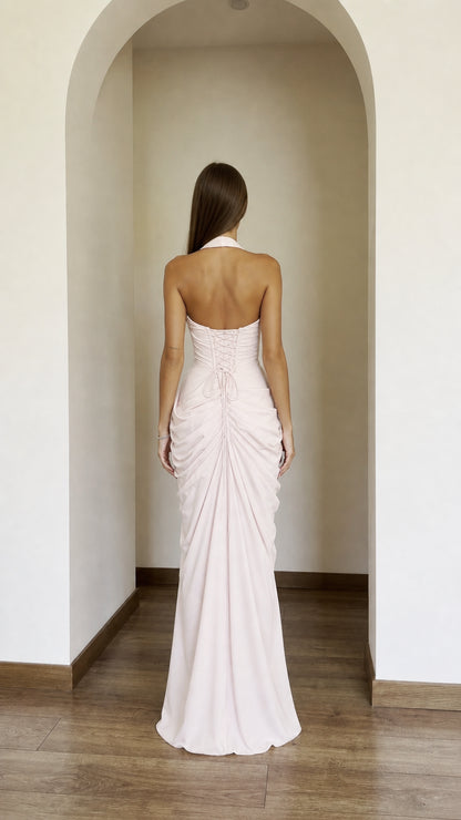 Back view showing lace-up detail of blush pink maxi dress