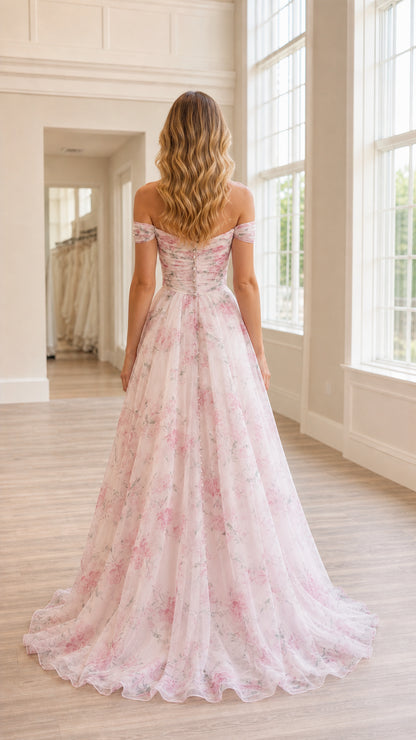 Back view of woman wearing blush pink floral off-the-shoulder dress