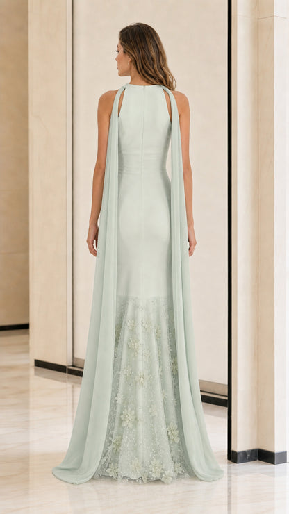 Back view showcasing the flowing cape and mermaid hem