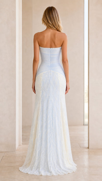 Back view of strapless formal gown showing floral lace train and back bodice