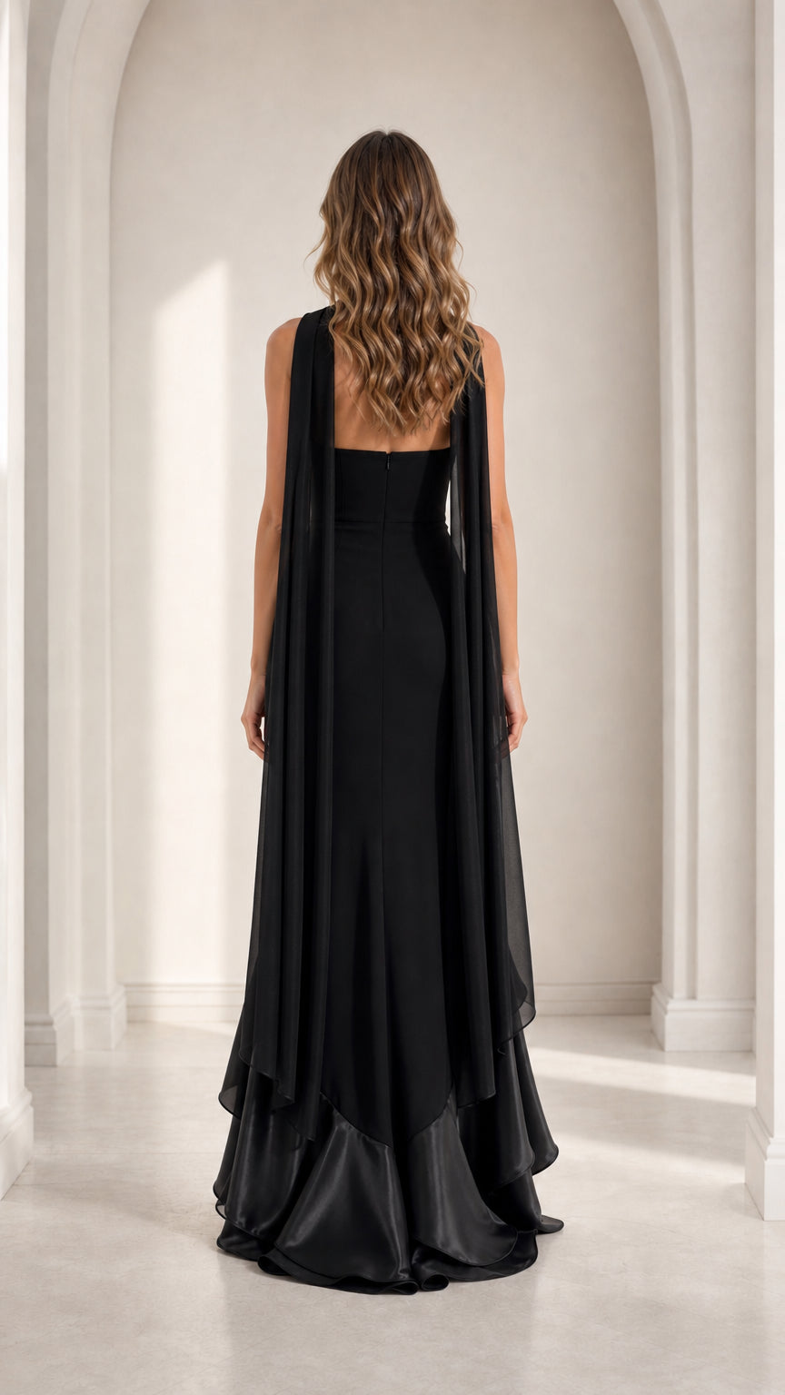 Black strapless evening maxi dress back view featuring floor-length trailing scarf cape