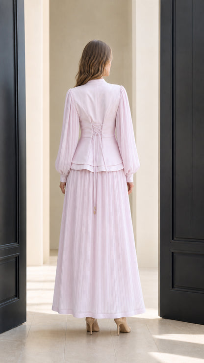Back view of light pink maxi dress showing lace-up back detail