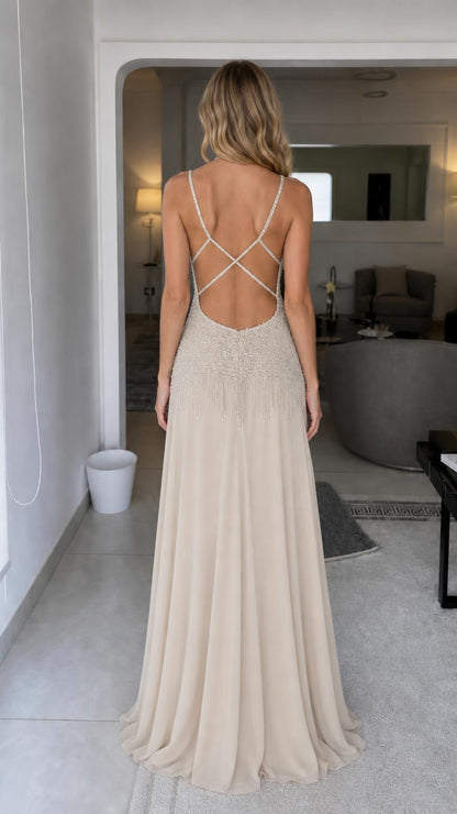 Back view showing criss-cross straps on champagne gown
