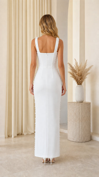 Back view of model in white pearl embellished maxi dress