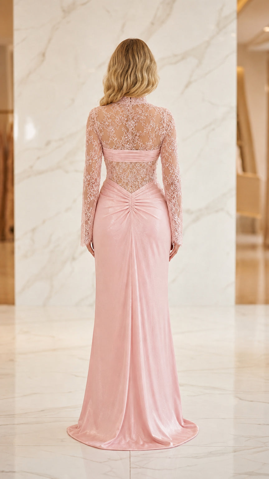 Model wearing pink evening gown, back view showing train
