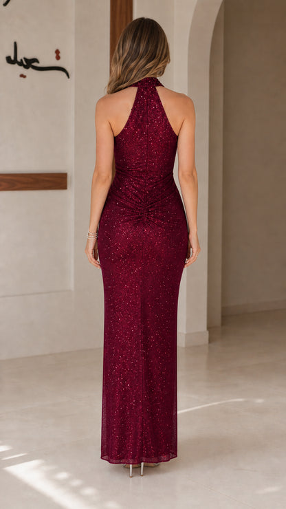 Burgundy sequin halter evening gown back view showing open shoulders