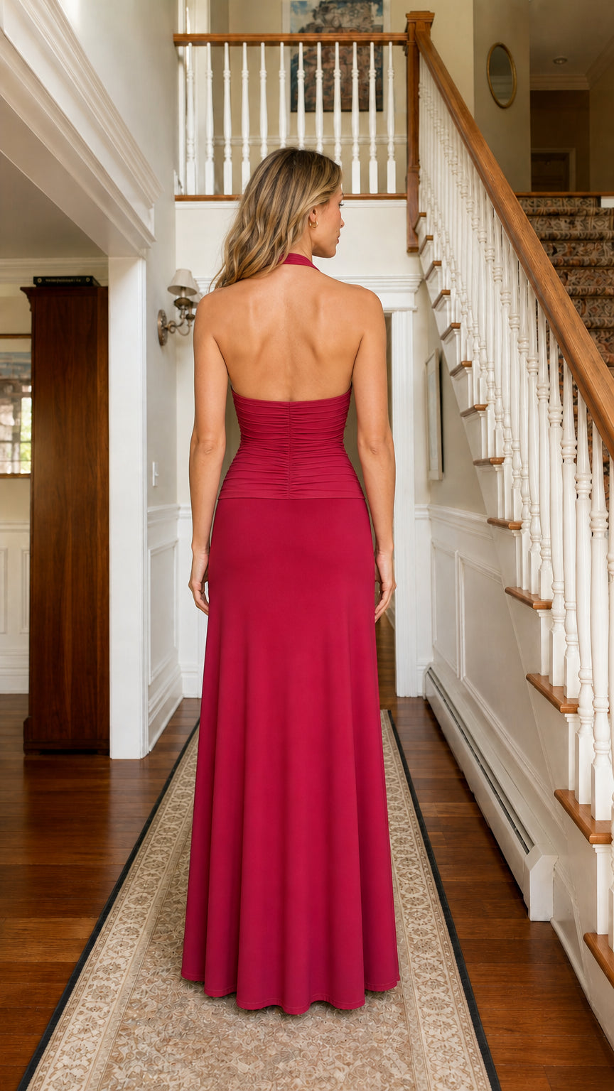 Model wearing Fuchsia halter rosette maxi dress from the back