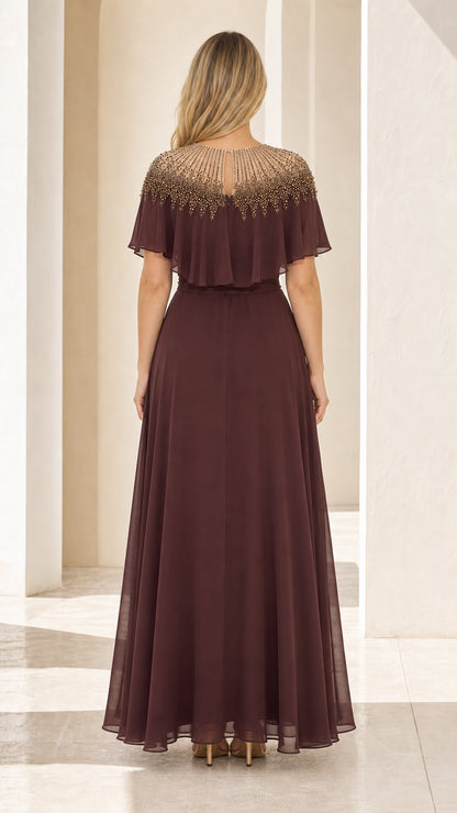 Back view of burgundy formal gown with capelet
