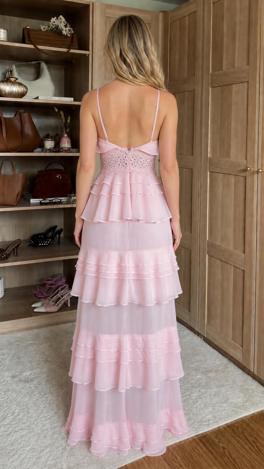 Back view of model wearing pink ruffled tiered maxi dress